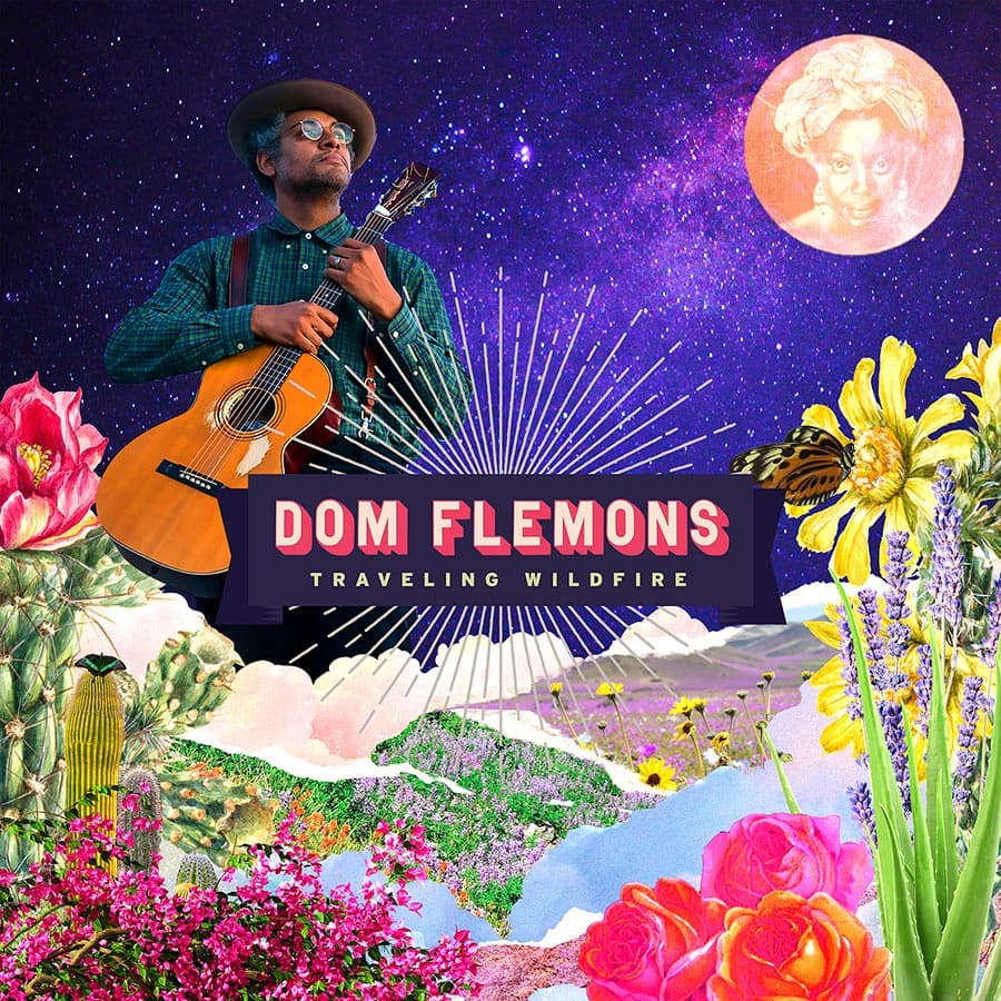 A man in a hat and glasses holds an acoustic guitar against a colorful, surreal collage of flowers, desert plants, mountains, a butterfly, and a pink moon with a vintage face. Text reads: "Dom Flemons Traveling Wildfire.