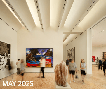 A modern art gallery with high ceilings and visitors observing colorful paintings and sculptures. The text "MAY 2025" appears in the lower left corner.