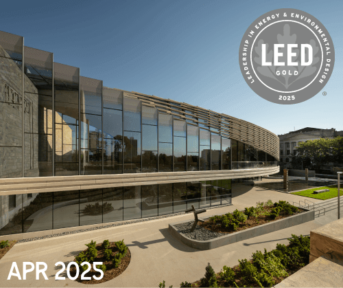 A modern, curved glass building with landscaped grounds is shown under a clear sky. A LEED Gold 2025 certification badge is in the top right corner. "APR 2025" is displayed in white text at the bottom left.