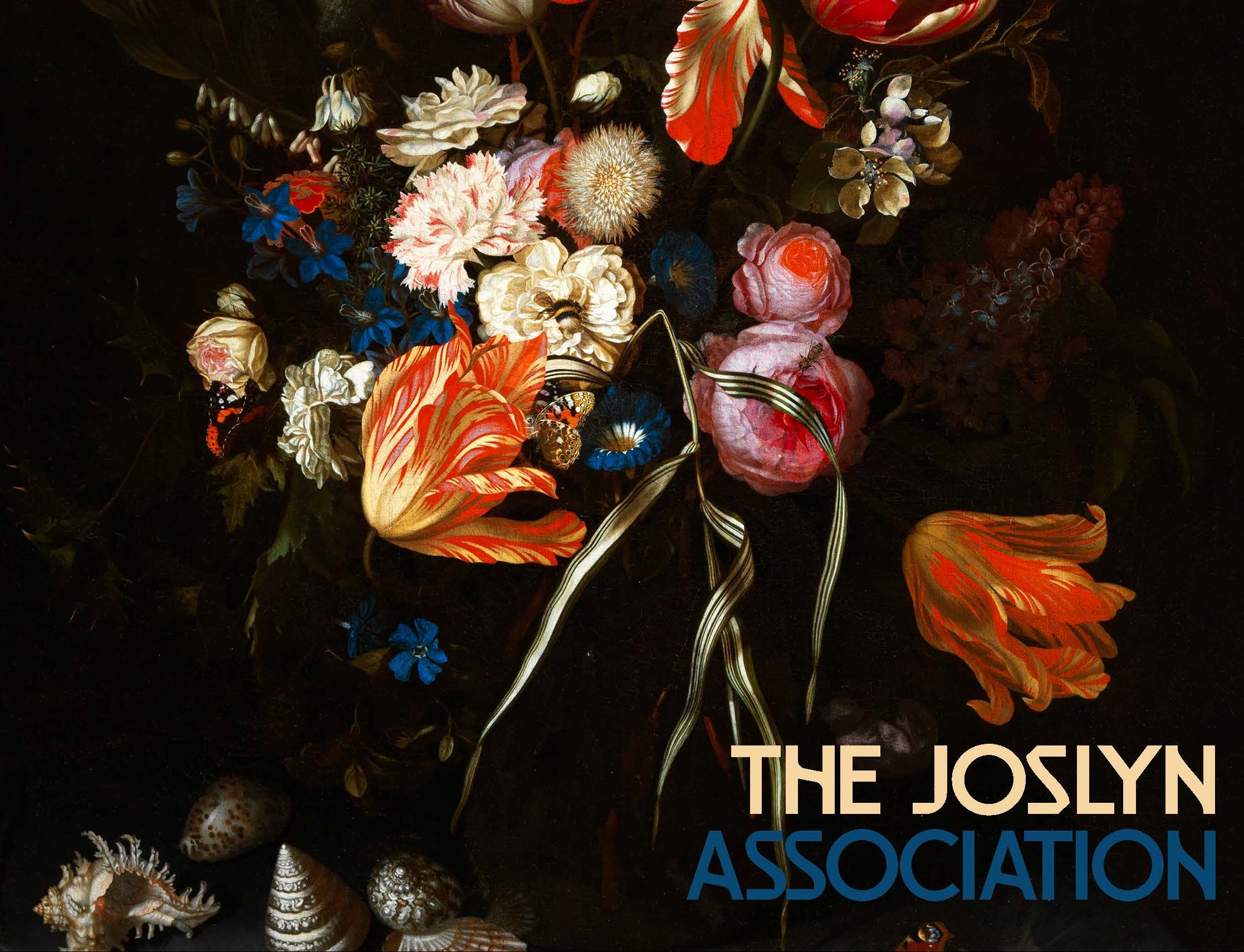 A luxurious floral arrangement featuring vivid red, pink, and white flowers with dark foliage in the background. Several seashells are at the bottom of the arrangement. The text "The Joslyn Association" is written in the bottom right corner, with "The Joslyn" also along the left side.