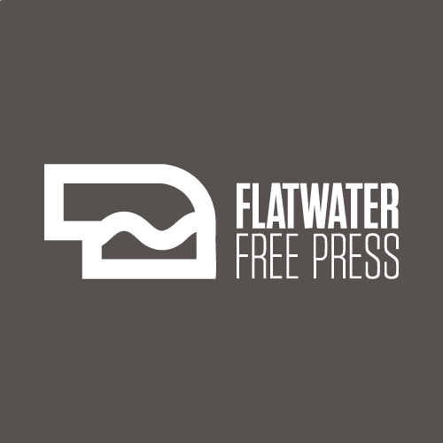 White Flatwater Free Press logo with bold text on a dark gray background. The logo features a stylized geometric shape with a wavy line, placed to the left of the publication's name.